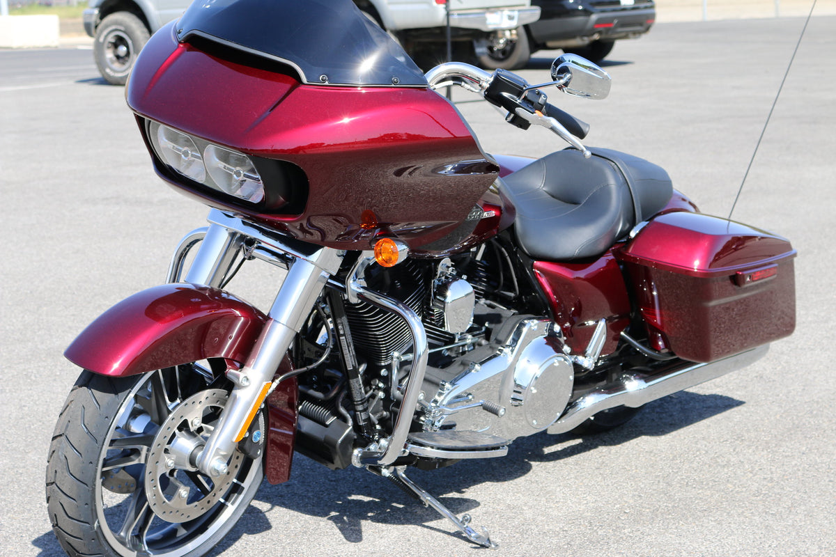 Red Harley-Davidson Road Glide (2015+ sharknose fairing) parked in a lot, three-quarter front