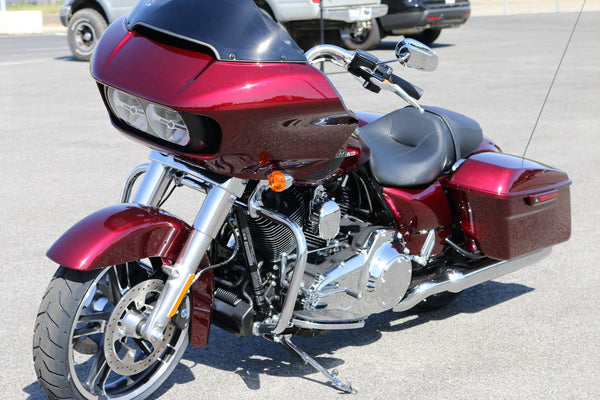 Red Harley-Davidson Road Glide (2015+ sharknose fairing) parked in a lot, three-quarter front