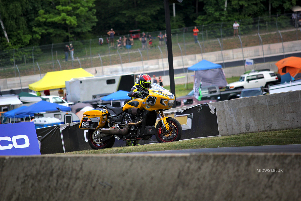 Yellow King of the Baggers race bike on track at MotoAmerica Road America, 2023