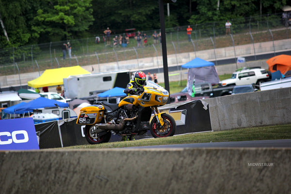 Yellow King of the Baggers race bike on track at MotoAmerica Road America, 2023