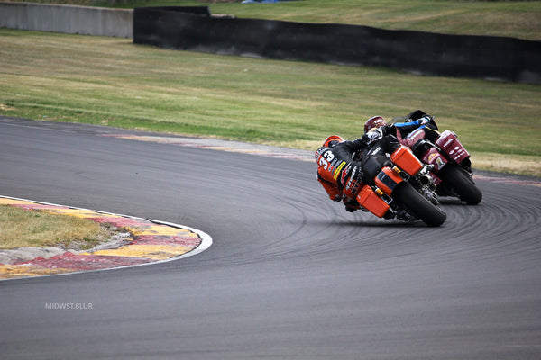 King of the Baggers racers leaning through Turn 6 at Road America, 2023