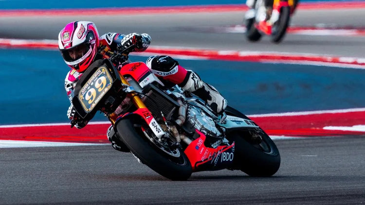 Hayden Gillim wheelying his Indian Challenger across the COTA start/finish straight after clinching the 2026 King of the Baggers championship